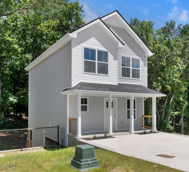 view of front of home featuring a front lawn and covered porch