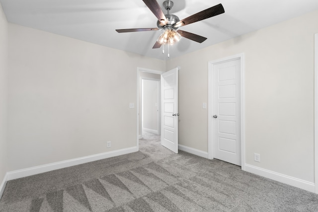 unfurnished bedroom with ceiling fan and carpet