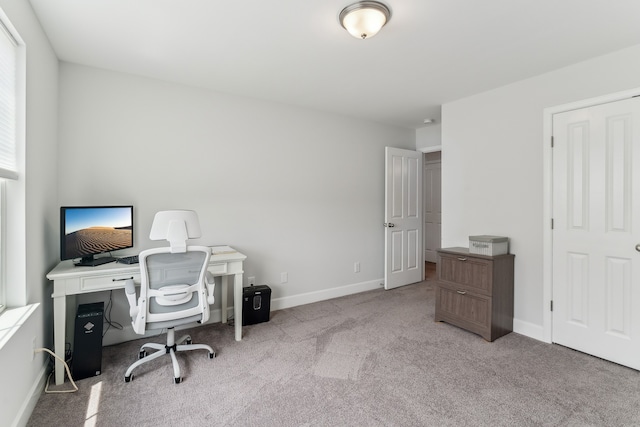 office area featuring light colored carpet