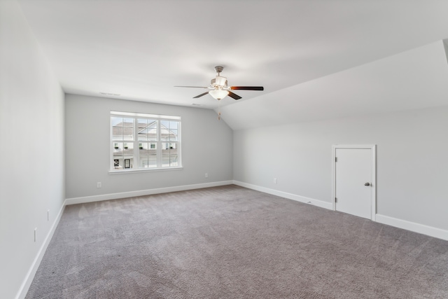 bonus room featuring vaulted ceiling, carpet flooring, and ceiling fan