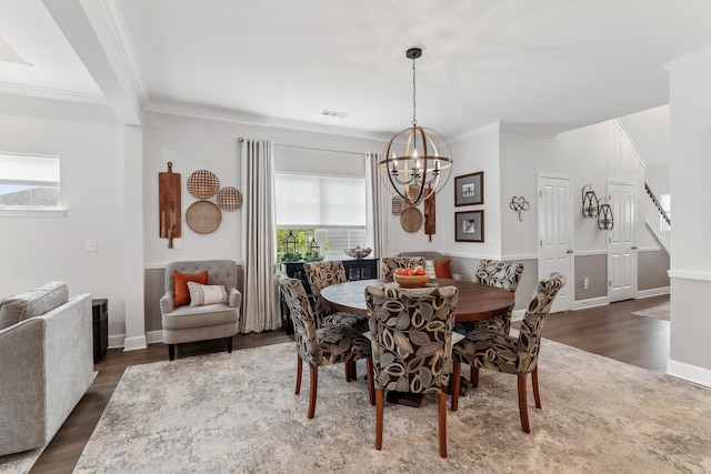 dining room with ornamental molding, dark wood-type flooring, and plenty of natural light