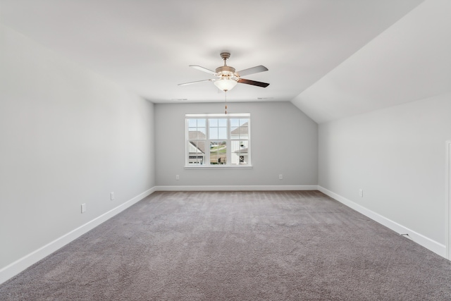 additional living space featuring lofted ceiling, carpet floors, and ceiling fan