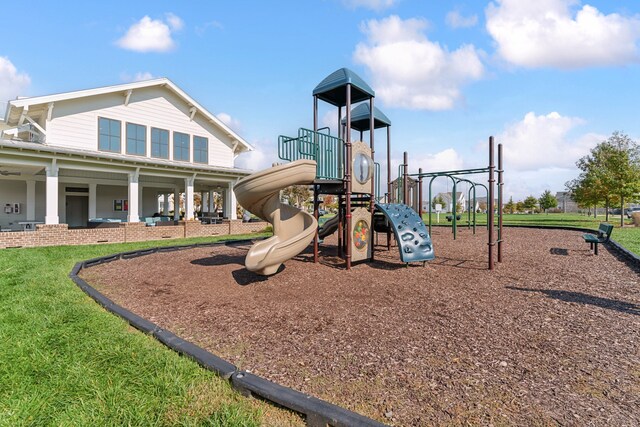 view of jungle gym featuring a lawn