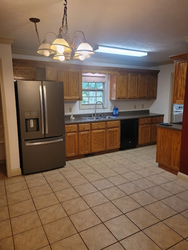 kitchen with crown molding, sink, hanging light fixtures, stainless steel fridge, and black dishwasher