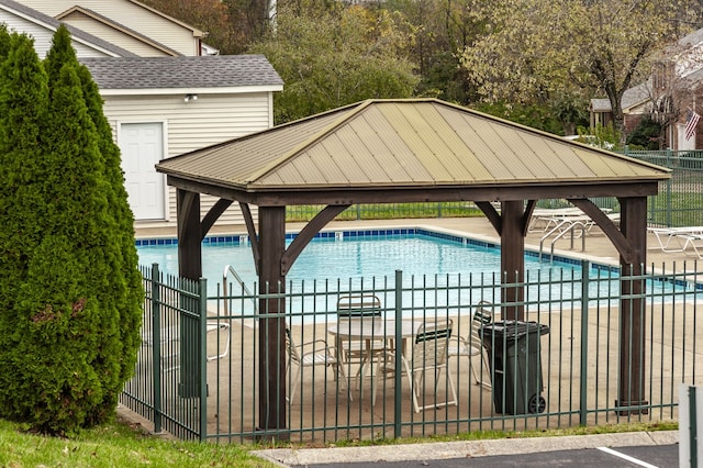 view of swimming pool featuring a gazebo and a patio