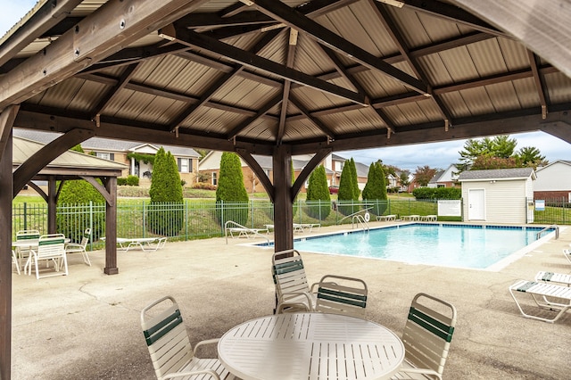 view of swimming pool featuring a gazebo and a patio area