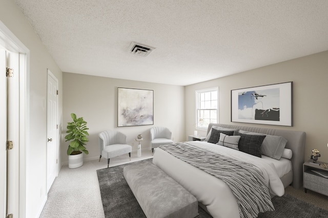 carpeted bedroom featuring a textured ceiling