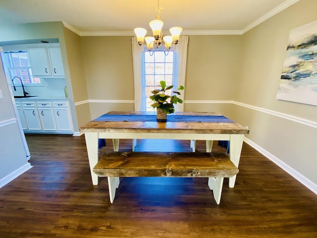 dining area featuring ornamental molding, dark wood-type flooring, sink, and an inviting chandelier