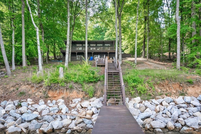 rear view of property with a wooden deck