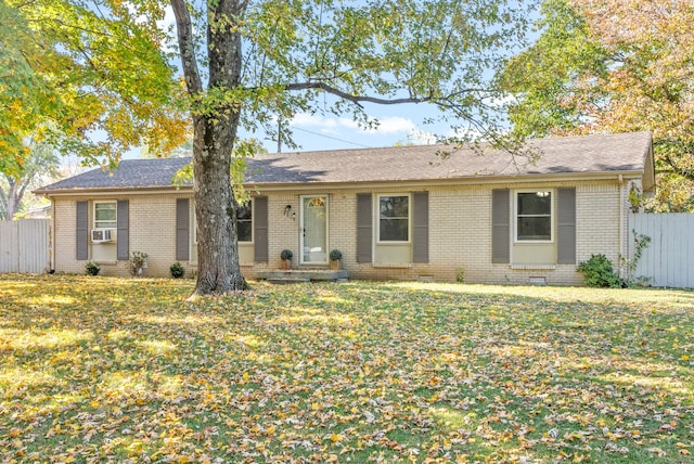 single story home with a front lawn