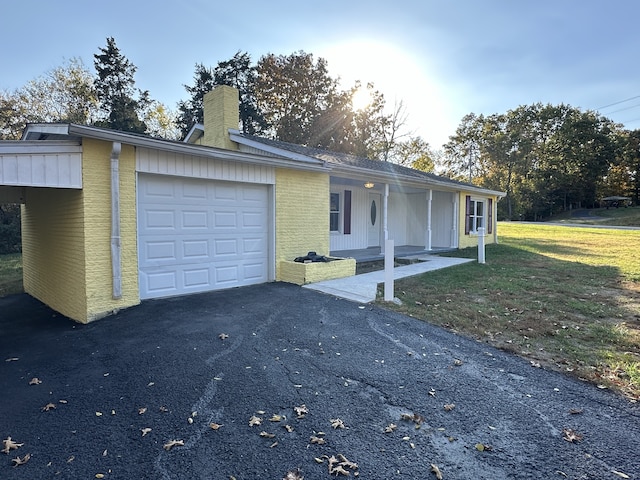 ranch-style house with a front lawn and a garage