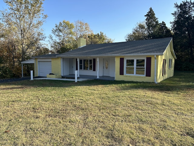 ranch-style house featuring a porch, a front yard, and a garage