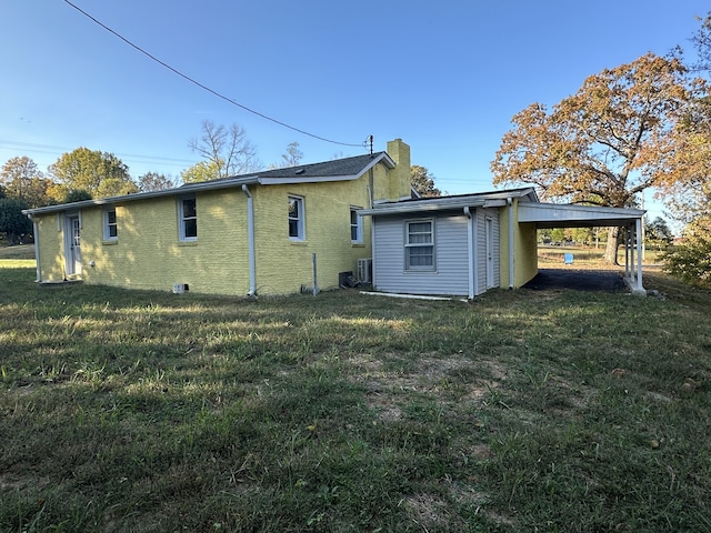 back of property with a yard