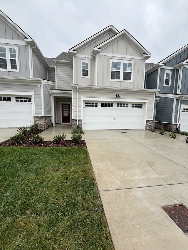 view of front of house with a garage and a front yard