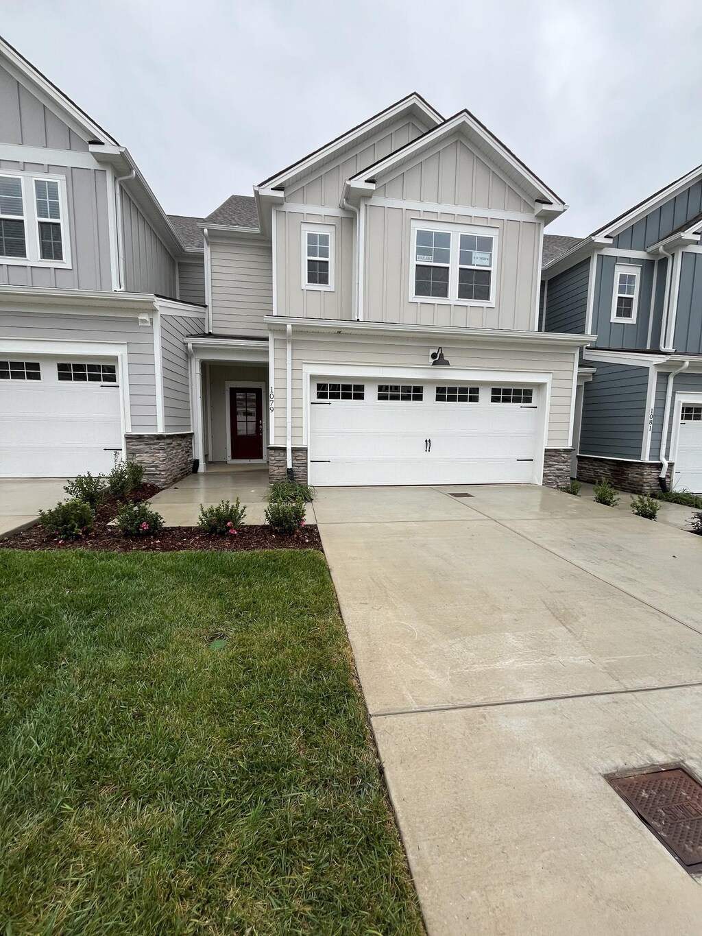 1079 June Wilde Rdg, Spring Hill, TN 37174 - craftsman-style home featuring board and batten siding, stone siding, a garage, and driveway