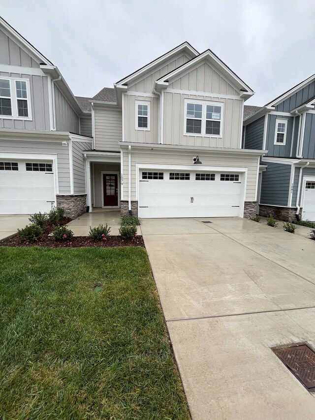 1079 June Wilde Rdg, Spring Hill, TN 37174 - craftsman-style home featuring board and batten siding, stone siding, a garage, and driveway