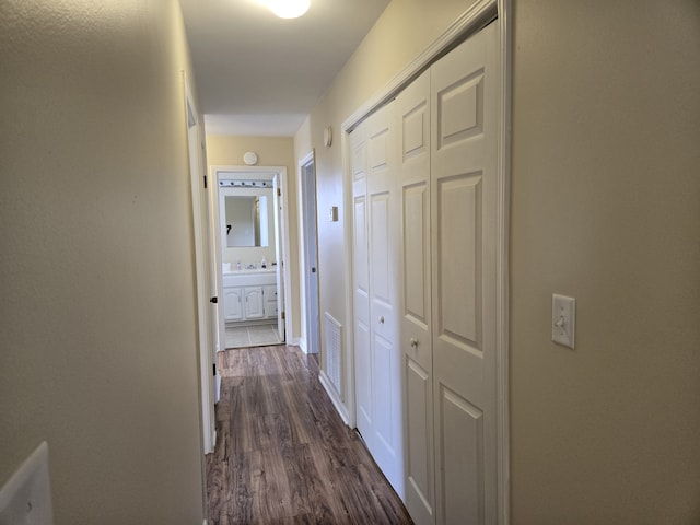 hallway featuring dark hardwood / wood-style floors