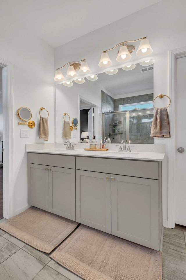 bathroom with vanity and an enclosed shower