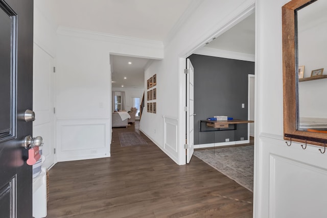 entrance foyer featuring crown molding and dark hardwood / wood-style floors