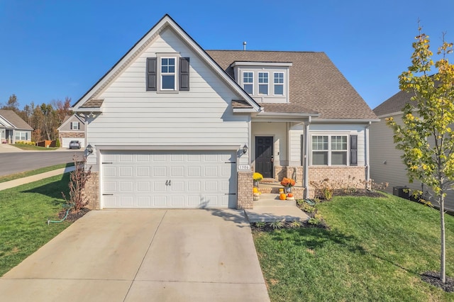 view of front of house featuring a front yard and a garage