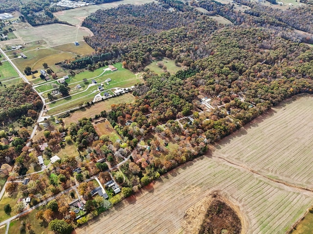 birds eye view of property with a rural view