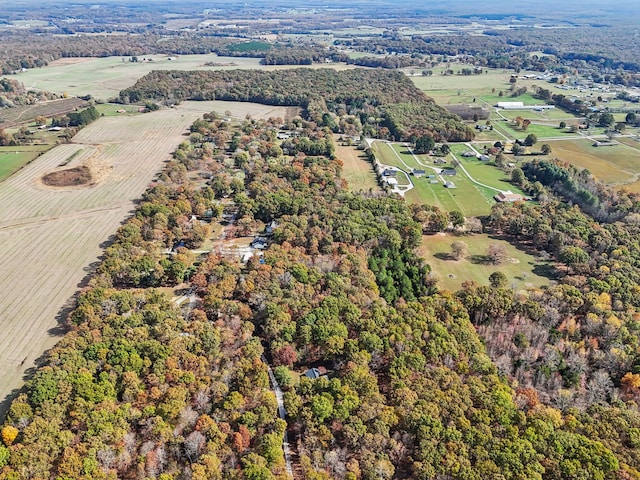 birds eye view of property with a rural view