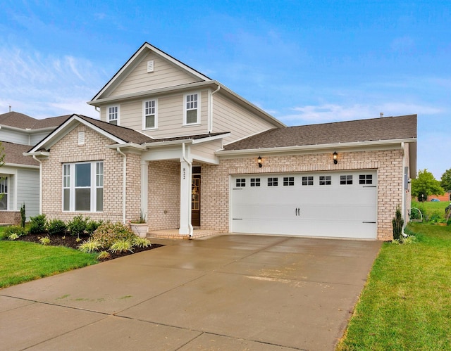 view of front facade with a front lawn and a garage