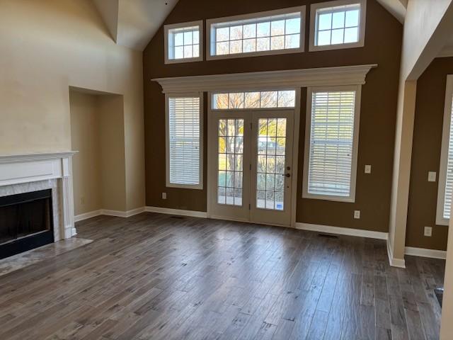 doorway featuring a high ceiling and dark hardwood / wood-style flooring