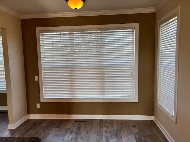 interior space featuring dark hardwood / wood-style floors and crown molding