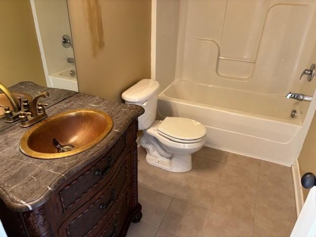 full bathroom featuring tile patterned flooring, vanity, bathing tub / shower combination, and toilet