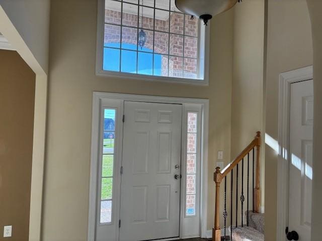 entrance foyer featuring a high ceiling