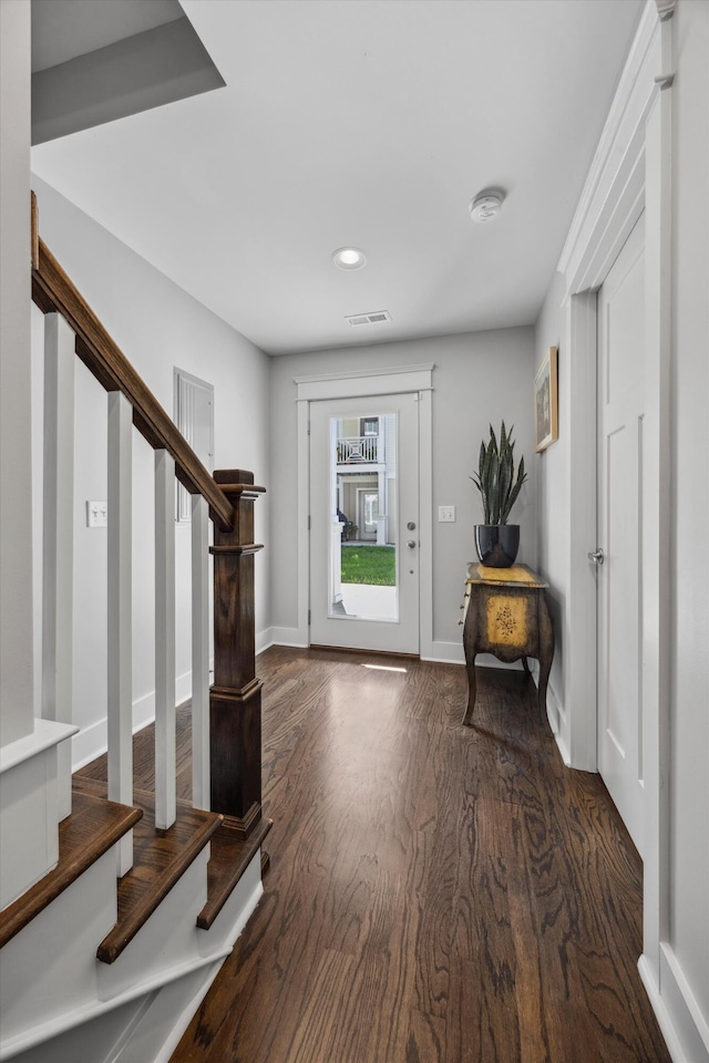 foyer entrance with dark wood-type flooring