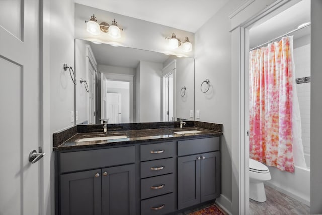 full bathroom featuring vanity, toilet, and shower / bath combination with curtain