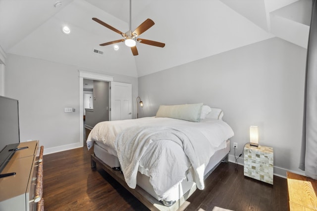 bedroom with dark hardwood / wood-style flooring, vaulted ceiling, and ceiling fan