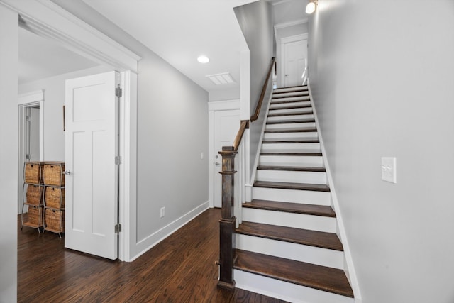 stairway with hardwood / wood-style flooring