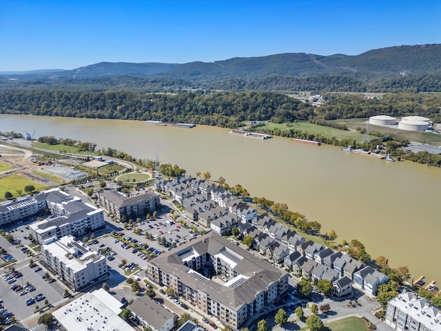 drone / aerial view featuring a water and mountain view