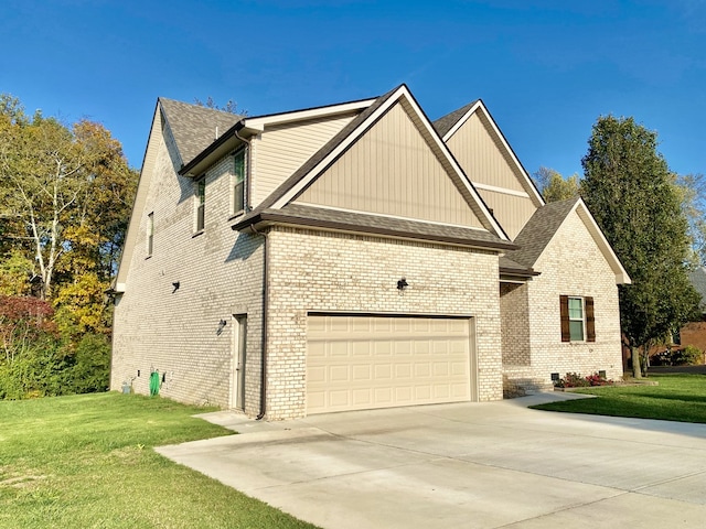 view of front of house with a garage and a front lawn