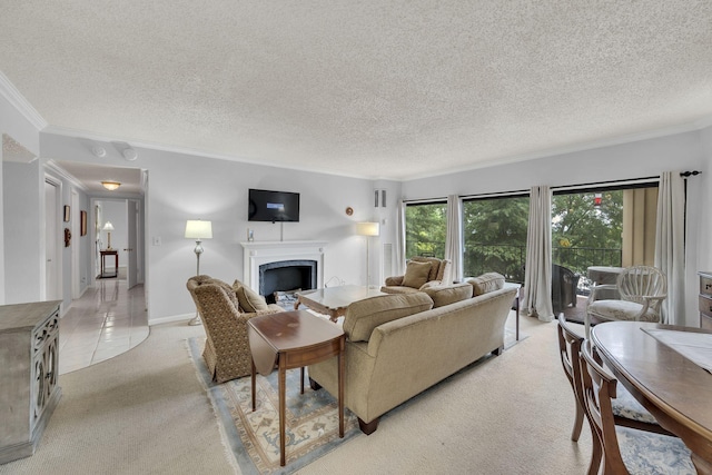 living area featuring light carpet, a fireplace, ornamental molding, and a textured ceiling