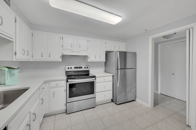 kitchen with sink, appliances with stainless steel finishes, and white cabinetry