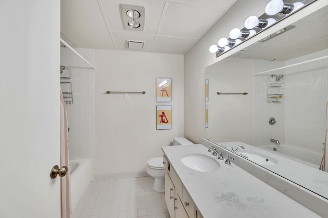 full bathroom with tiled shower / bath, vanity, toilet, and tile patterned flooring