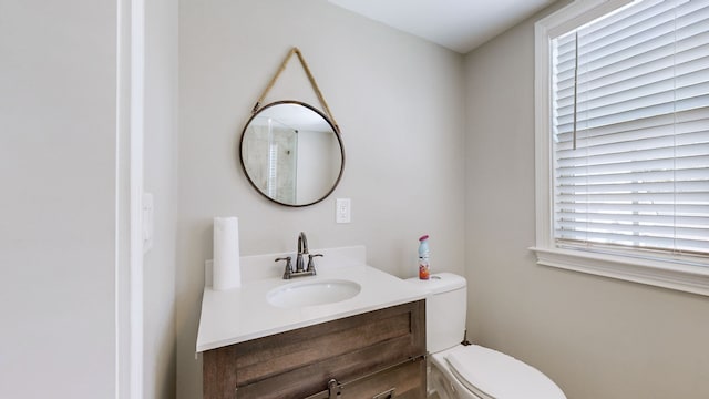 bathroom with vanity and toilet