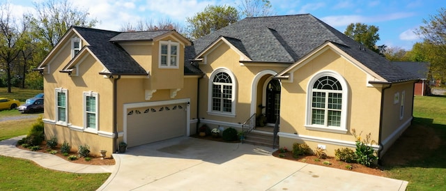 view of front of home with a garage