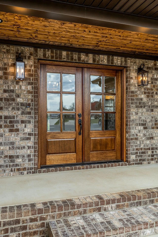 view of exterior entry featuring french doors