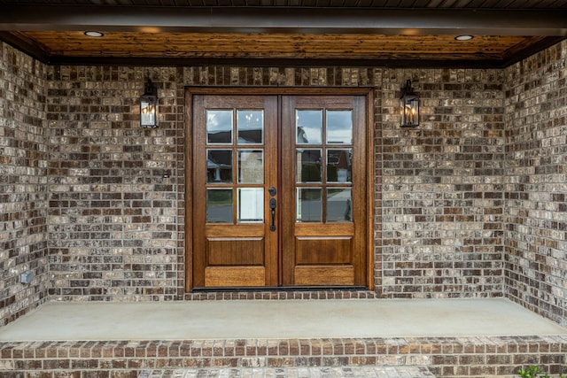 property entrance featuring french doors