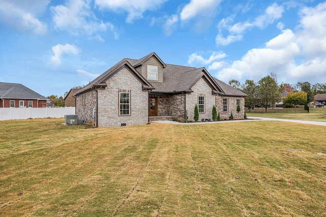 view of front of property with cooling unit and a front lawn