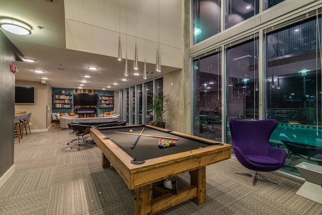 playroom with a high ceiling, billiards, and carpet