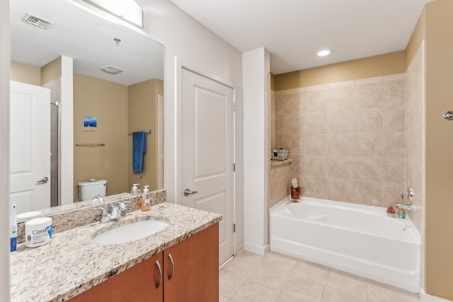 bathroom featuring vanity, toilet, and tile patterned floors