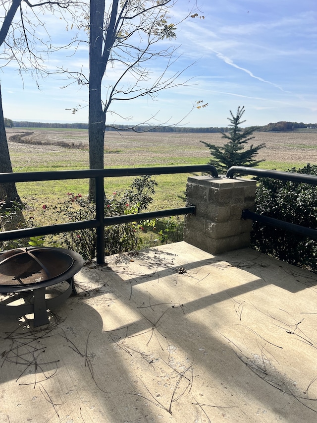 view of patio / terrace with a rural view