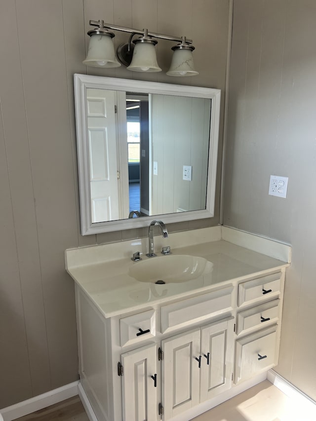 bathroom with vanity and hardwood / wood-style flooring