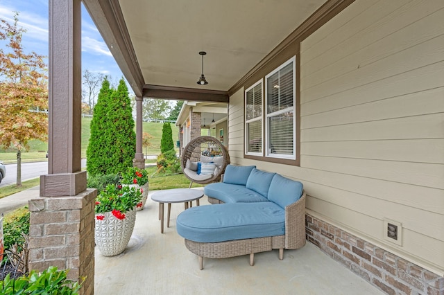 view of patio featuring a porch